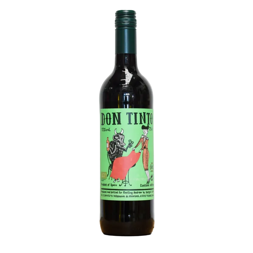 Wine bottle with a colourful label depicting a matador laying a red tablecloth for a bull drinking a bottle of wine.