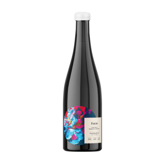 Black wine bottle with colorful label on a white background.
